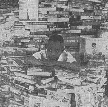 Child Surrounded by Books